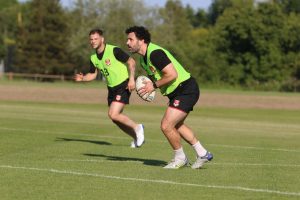 Rhys Williams running with the ball.